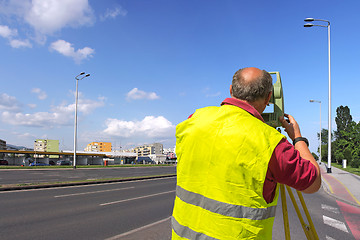 Image showing Surveyor measuring