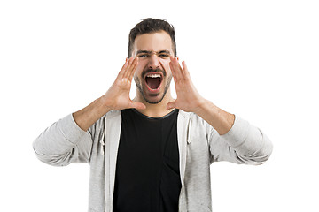 Image showing Man shouting through the hands