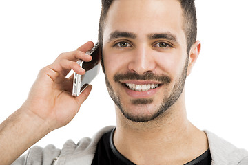 Image showing Young man talking on cell phone