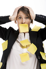 Image showing Woman with yellow paper notes