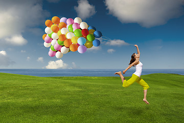 Image showing Girl with colorful balloons