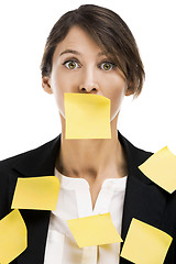 Image showing Woman with yellow paper notes