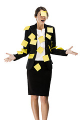 Image showing Woman with yellow paper notes