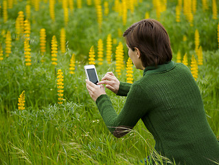 Image showing Taking pictures with a cellphone