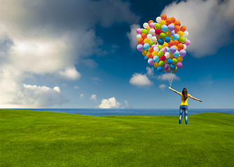 Image showing Girl with colorful balloons