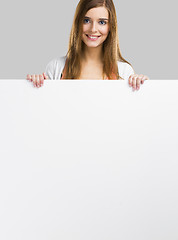 Image showing Woman with a big blank board