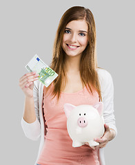 Image showing Woman saving money