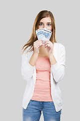 Image showing Beautiful woman holding money