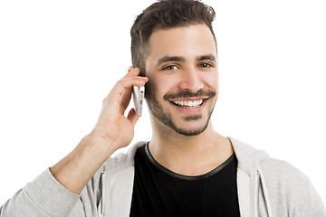 Image showing Young man talking on cell phone