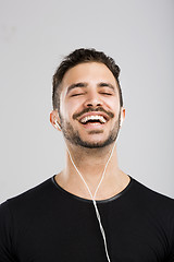 Image showing Happy man listen music