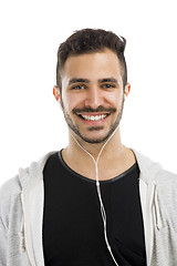 Image showing Man smiling and listen music