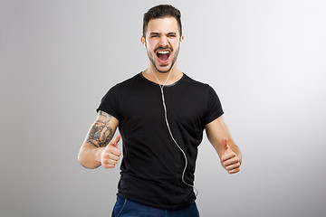 Image showing Happy man listen music