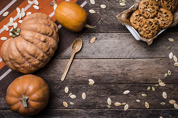 Image showing Pumpkins and cookies on wood in Rustic style 