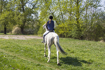 Image showing Young woman riding