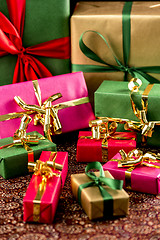 Image showing Nine Wrapped Presents in Plain Colors
