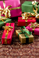 Image showing Seven Little Presents with Bows
