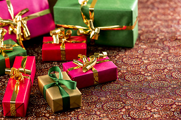 Image showing Seven Small Gifts on a Festive Blanket