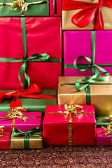 Image showing Towering Stack of Gifts
