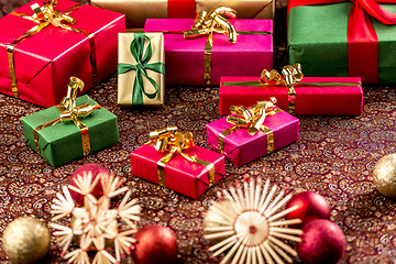 Image showing Christmas Gifts on Richly Textured Cloth