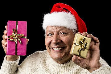 Image showing Happy Male Senior Showing Two Wrapped Presents