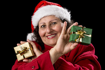 Image showing Smiling Female Senior Showing Two Wrapped Gifts
