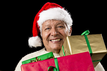 Image showing Jolly Old Man With Santa Cap And Three Xmas Gifts