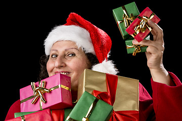 Image showing Perky Female Pensioner Presenting Wrapped Gifts
