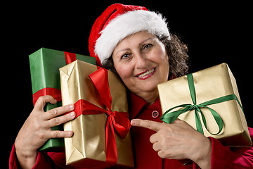 Image showing Elderly Woman with Three Wrapped Christmas Gifts
