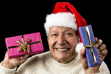 Image showing Lighthearted, Smiling Old Man Offering Two Gifts