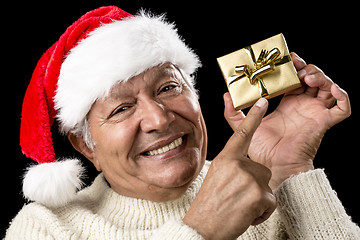 Image showing Playful Male Pensioner Pointing At Golden Gift