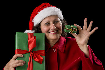 Image showing Smiling Old Woman Offering a Small and a Big Gift
