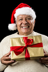 Image showing Grey-Haired Man Offering Golden Wrapped Present