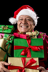 Image showing Merry Old Man With Broad Grin Loaded With Gifts