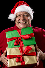 Image showing Jolly Male Pensioner In Red With Two Wrapped Gifts