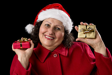 Image showing Elderly Lady with Wrapped Red and Golden Presents
