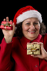 Image showing Happy Old Woman with Santa Hat and Two Xmas Gifts
