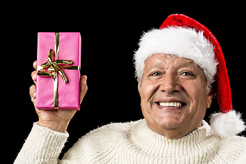 Image showing Merry Old Man Showcasing A Pink Wrapped Present