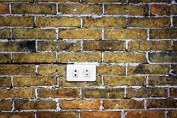 Image showing Brick Wall Electric Socket