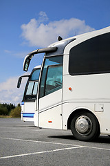 Image showing Two White Coach Buses and Summer Sky