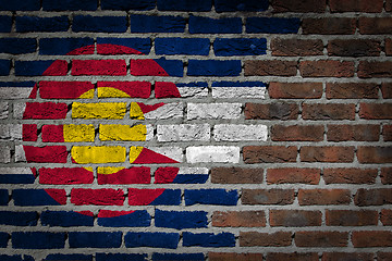 Image showing Brick wall texture with flag