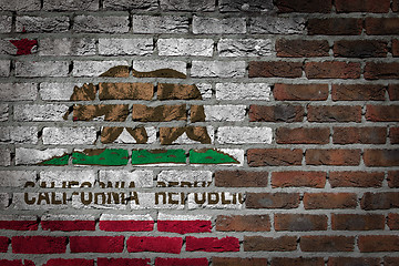 Image showing Brick wall texture with flag