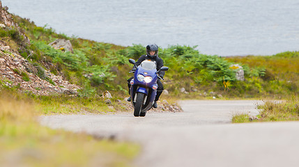 Image showing Motorcyclist in the Scottish Highlands