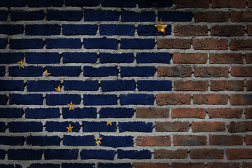 Image showing Brick wall texture with flag