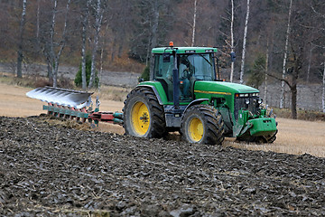 Image showing John Deere 8100 Agricultural Tractor and Kverneland PB100 Plough