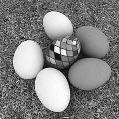 Image showing Eggs and easter eggs on the grass