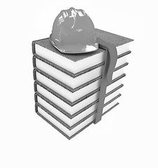 Image showing Stack of leather technical book with belt and hard hat