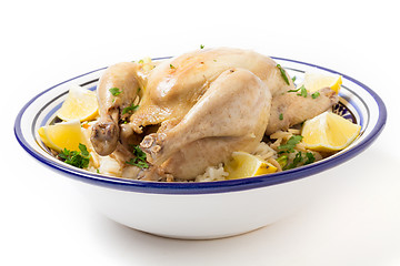 Image showing Chicken on pilaf rice in a Tunisian serving bowl