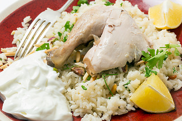 Image showing Chicken pilaf with fork closeup