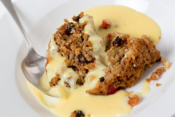 Image showing college pudding and custard with a spoon