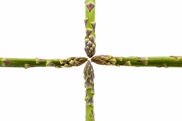 Image showing Four Asparagus Spears Meeting in the Middle